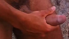 Three muscled studs feed their desire for masturbation at the beach